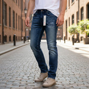 DIESEL Thavar-NE R060S W28 vyriški siaurėjantys džinsai su sendinto audinio efektu, mėlyni